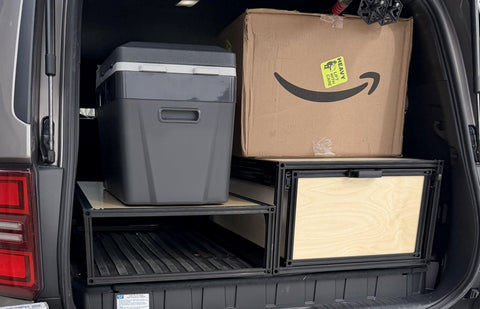 land cruiser rear cargo storage solution with drawers and a platform deck